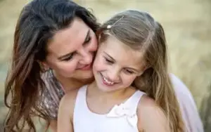mom and daughter smiling