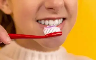 woman about to brush teeth