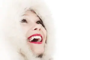 https://www.pexels.com/photo/women-s-red-lipstick-41208/ Woman wearing a fur hood and smiling