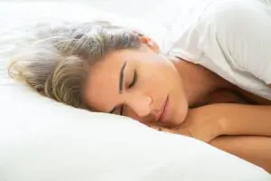 https://www.pexels.com/photo/woman-lying-on-white-bed-5990957/ Woman sleeping