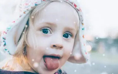 little girl sticking out tongue