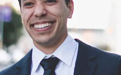 young man in suit smiling
