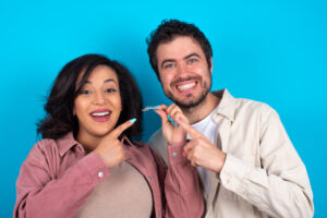 couple with clear aligner orthodontics concept