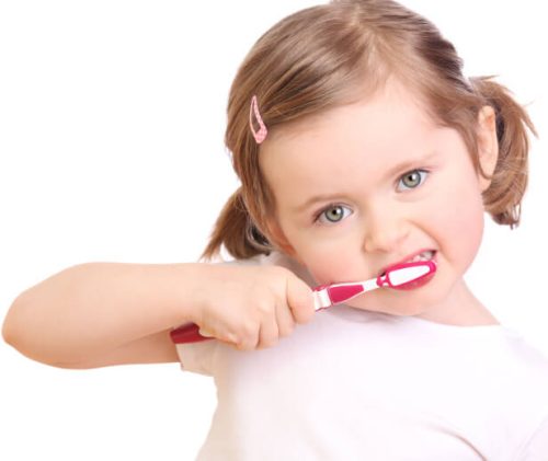 little girl brushing teeth