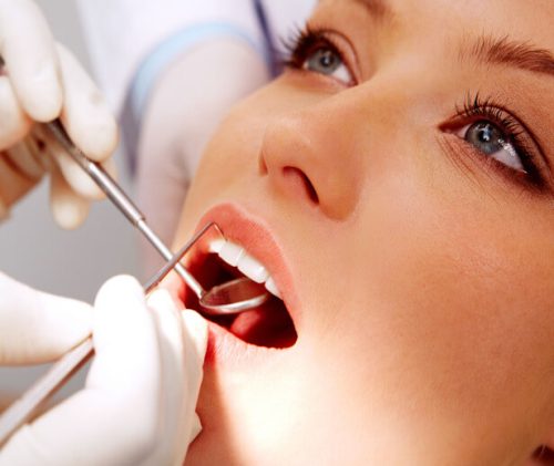 woman receiving dental exam